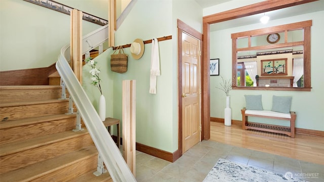 10539 N Madison Ave NE, Bainbridge Island, WA 98110 - staircase with baseboards and tile patterned floors