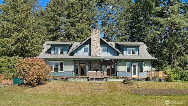 10539 N Madison Ave NE, Bainbridge Island, WA 98110 - back of property with a chimney, a lawn, and a deck