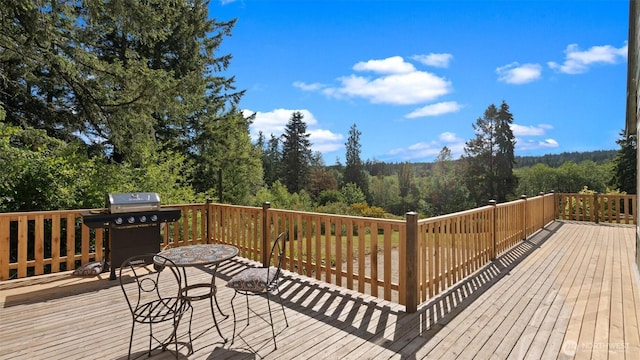 10539 N Madison Ave NE, Bainbridge Island, WA 98110 - wooden terrace with area for grilling and a forest view