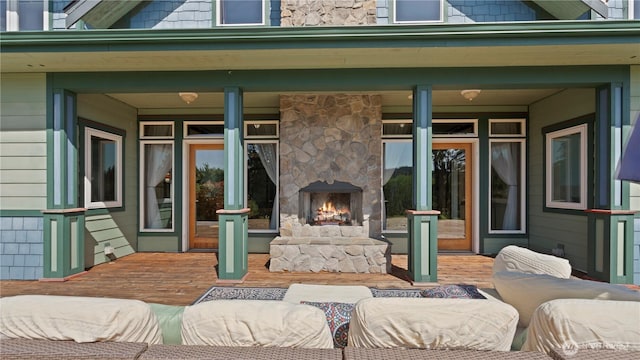 10539 N Madison Ave NE, Bainbridge Island, WA 98110 - view of patio featuring an outdoor stone fireplace and a deck