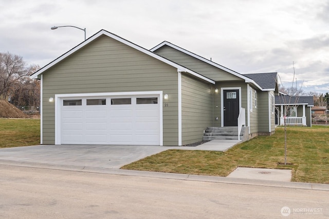 123 E 9th Ave Unit 67, Moses Lake, WA 98837 - ranch-style home featuring concrete driveway, a front yard, and a garage
