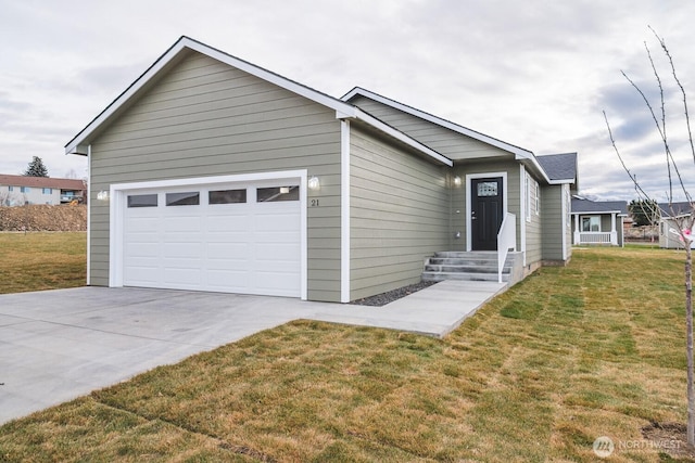 123 E 9th Ave Unit 67, Moses Lake, WA 98837 - ranch-style home featuring concrete driveway, a garage, and a front lawn