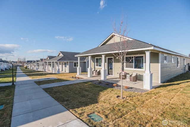 123 E 9th Ave Unit 67, Moses Lake, WA 98837 - view of front of house featuring covered porch and a front yard