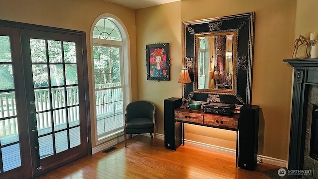 10920 Chaucer St SE, Olympia, WA 98501 - entryway with wood finished floors, baseboards, and a fireplace