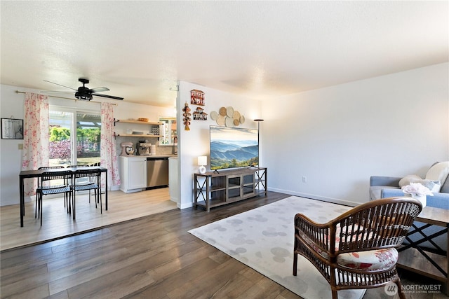 5601 Mount Tahoma Ct SE, Lacey, WA 98503 - living area featuring wood finished floors, baseboards, and ceiling fan