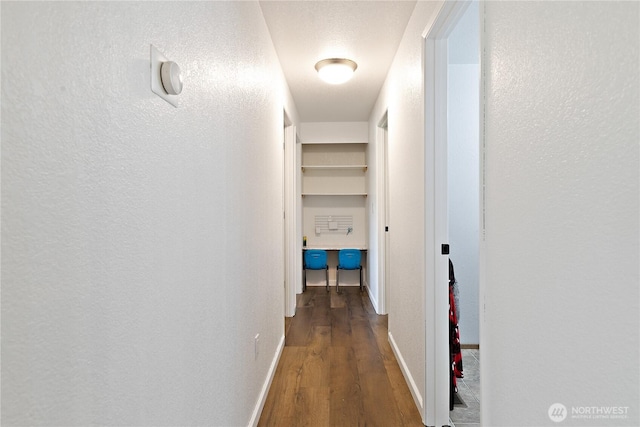 5601 Mount Tahoma Ct SE, Lacey, WA 98503 - hall with wood finished floors, baseboards, and a textured wall