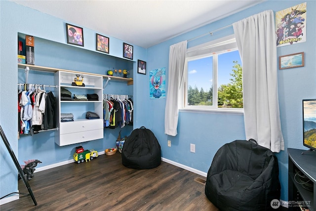 5601 Mount Tahoma Ct SE, Lacey, WA 98503 - bedroom with wood finished floors, a closet, and baseboards