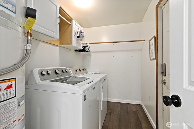 5601 Mount Tahoma Ct SE, Lacey, WA 98503 - laundry room featuring cabinet space, washer and clothes dryer, dark wood-type flooring, baseboards, and water heater