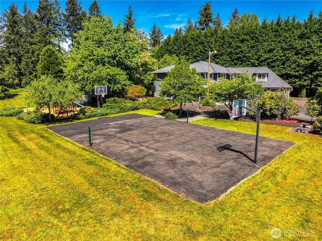 16710 Snohomish Ave, Snohomish, WA 98296 - view of sport court featuring basketball hoop and a lawn