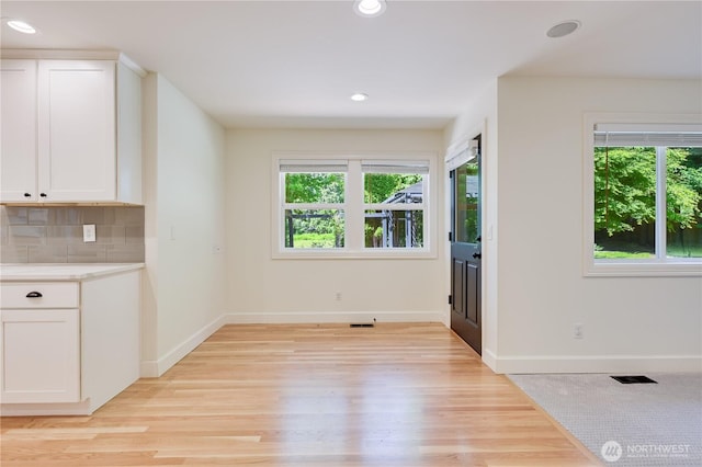 16710 Snohomish Ave, Snohomish, WA 98296 - unfurnished dining area with healthy amount of natural light, light wood-style floors, baseboards, and recessed lighting