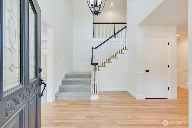 16710 Snohomish Ave, Snohomish, WA 98296 - entrance foyer featuring stairway, light wood-style floors, a chandelier, and baseboards