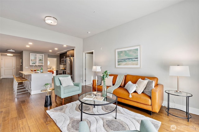 50 Pine St Unit 420, Edmonds, WA 98020 - living room featuring light wood finished floors, recessed lighting, and baseboards