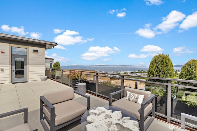 50 Pine St Unit 420, Edmonds, WA 98020 - view of patio with a water view and a balcony
