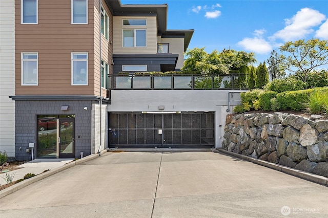 50 Pine St Unit 420, Edmonds, WA 98020 - rear view of house with a gate and driveway