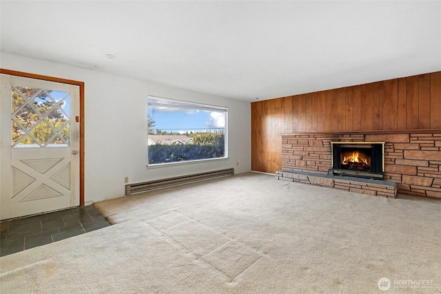 3115 43rd Ave NE, Tacoma, WA 98422 - unfurnished living room featuring a baseboard radiator, a fireplace, wooden walls, and carpet