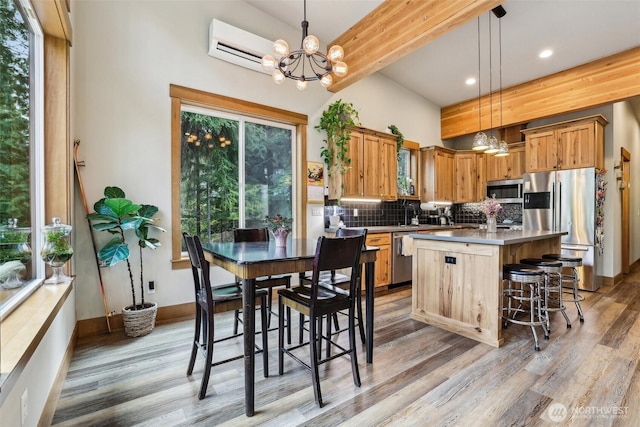 3271 Via Kachess Rd, Easton, WA 98925 - kitchen with appliances with stainless steel finishes, light wood-style floors, tasteful backsplash, a chandelier, and recessed lighting