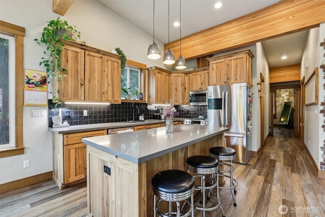 3271 Via Kachess Rd, Easton, WA 98925 - kitchen with appliances with stainless steel finishes, tasteful backsplash, light wood-type flooring, a center island, and recessed lighting