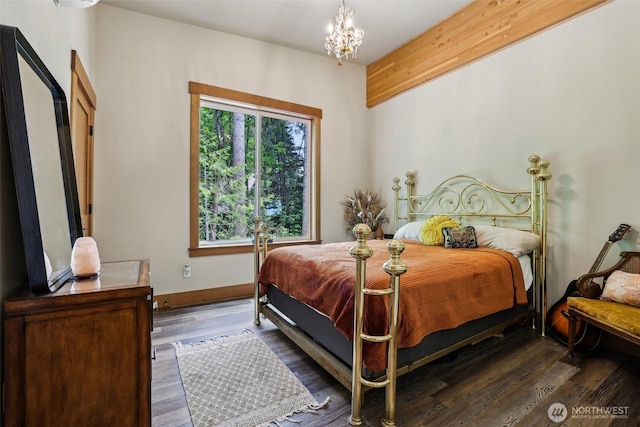3271 Via Kachess Rd, Easton, WA 98925 - bedroom with a chandelier, wood finished floors, and baseboards