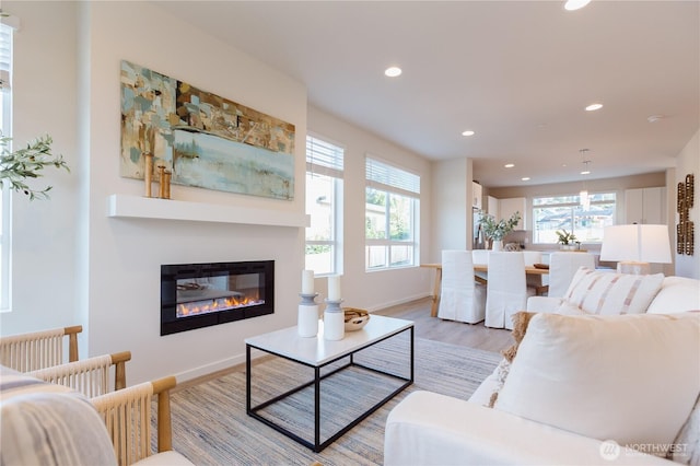 3620 W Mukilteo Blvd Unit E, Everett, WA 98203 - living area with recessed lighting, light wood-style flooring, a glass covered fireplace, and baseboards