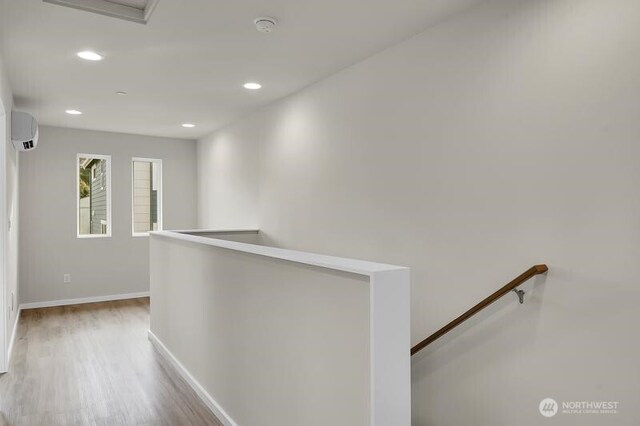 3620 W Mukilteo Blvd Unit E, Everett, WA 98203 - hall featuring an upstairs landing, a wall mounted air conditioner, wood finished floors, baseboards, and recessed lighting