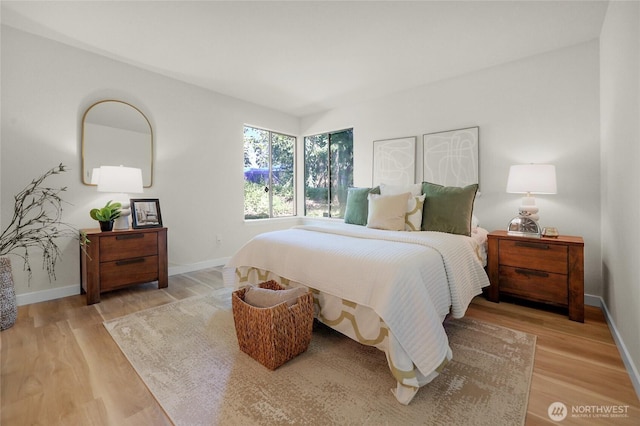 12707 NE 130th Ct Unit B102, Kirkland, WA 98034 - bedroom with light wood-style floors and baseboards