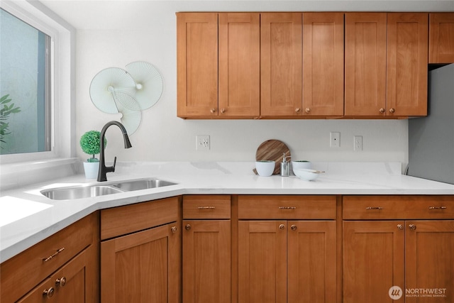 12707 NE 130th Ct Unit B102, Kirkland, WA 98034 - kitchen featuring a sink, light countertops, and brown cabinets