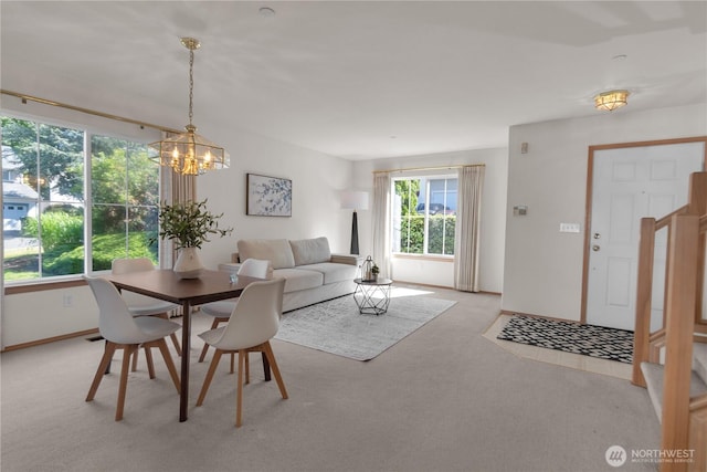 22111 96th Pl S, Kent, WA 98031 - dining room featuring light colored carpet, a chandelier, and baseboards