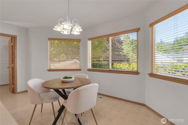 22111 96th Pl S, Kent, WA 98031 - dining area with light floors, a chandelier, and baseboards