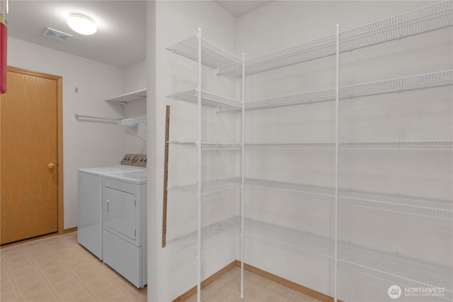22111 96th Pl S, Kent, WA 98031 - laundry room with washing machine and dryer and tile patterned floors
