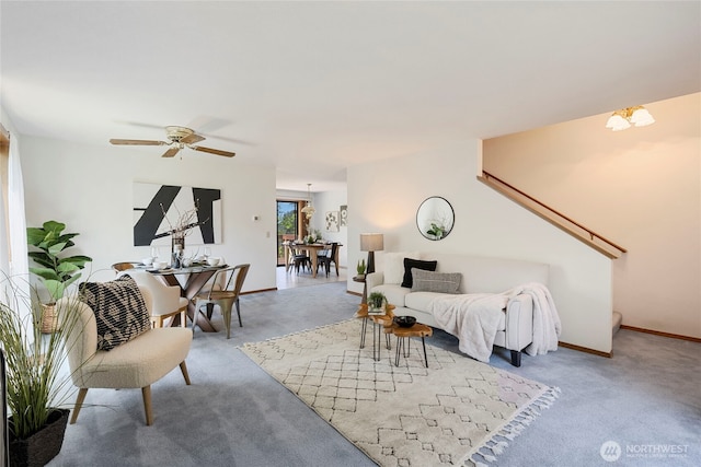 3861 Gala Loop, Bellingham, WA 98226 - carpeted living room featuring ceiling fan, baseboards, stairway, and a chandelier