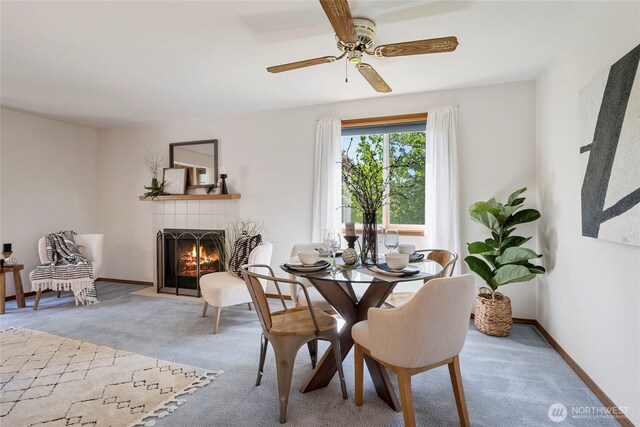 3861 Gala Loop, Bellingham, WA 98226 - dining room with carpet floors, a fireplace, a ceiling fan, and baseboards