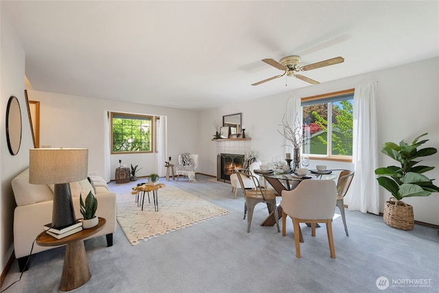 3861 Gala Loop, Bellingham, WA 98226 - dining area with a tile fireplace, light colored carpet, and ceiling fan