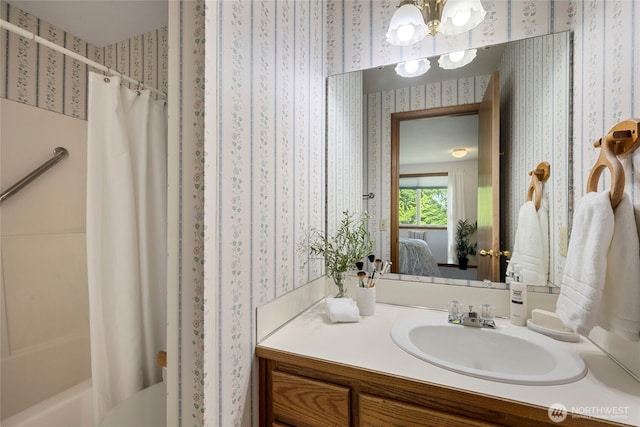 3861 Gala Loop, Bellingham, WA 98226 - ensuite bathroom with wallpapered walls, vanity, shower / bath combo, and a chandelier