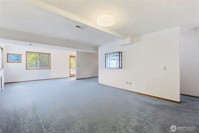 3861 Gala Loop, Bellingham, WA 98226 - empty room featuring carpet flooring, baseboards, and beamed ceiling