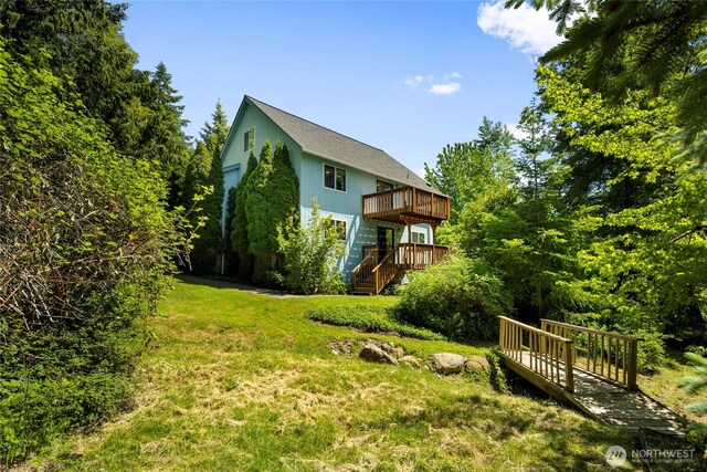 3861 Gala Loop, Bellingham, WA 98226 - back of property featuring a wooden deck, a yard, and stairway