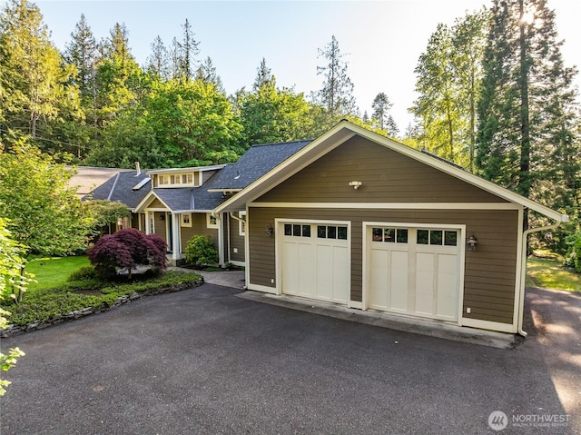 761 Chuckanut Dr, Bellingham, WA 98229 - view of front of house with a shingled roof, asphalt driveway, and an attached garage