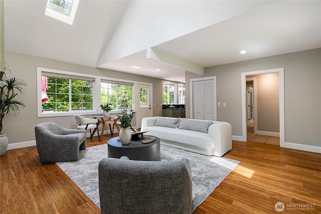 761 Chuckanut Dr, Bellingham, WA 98229 - living room featuring baseboards, a skylight, wood finished floors, and recessed lighting