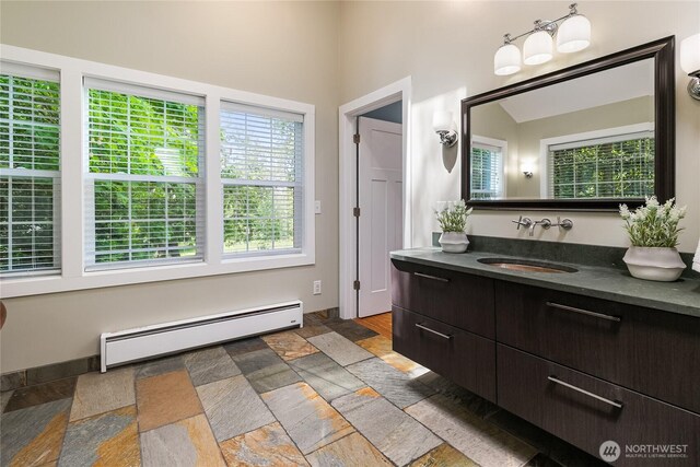 761 Chuckanut Dr, Bellingham, WA 98229 - bathroom featuring a baseboard radiator, vanity, and stone finish flooring
