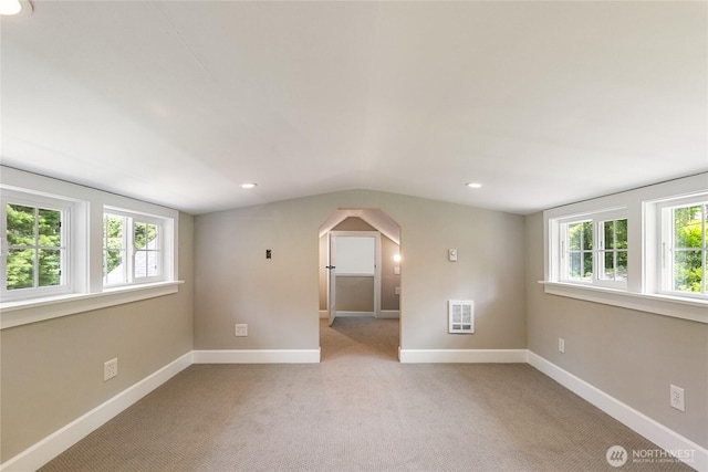 761 Chuckanut Dr, Bellingham, WA 98229 - spare room with arched walkways, light carpet, vaulted ceiling, baseboards, and recessed lighting
