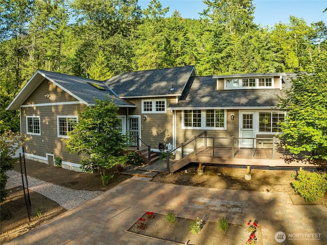 761 Chuckanut Dr, Bellingham, WA 98229 - rear view of house with a deck, a shingled roof, and a wooded view