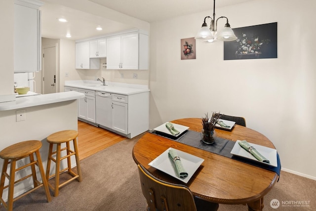 18904 8th Ave NW Unit 128, Shoreline, WA 98177 - dining room featuring light colored carpet, recessed lighting, and a chandelier