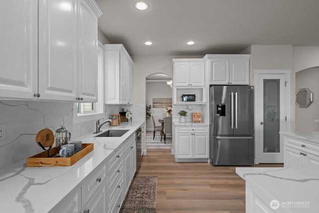 9304 S 223rd Pl, Kent, WA 98031 - kitchen featuring appliances with stainless steel finishes, a sink, white cabinets, recessed lighting, and light wood-style flooring