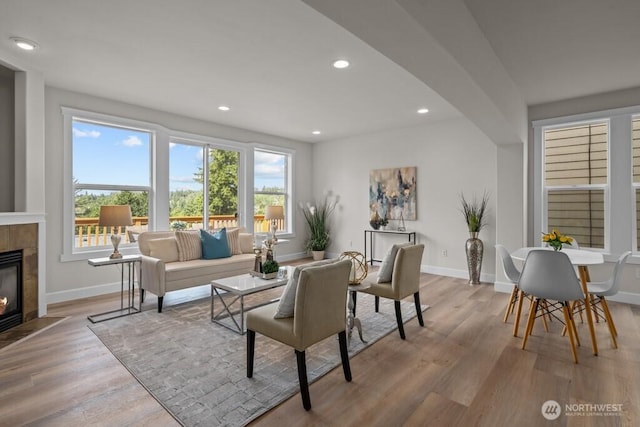 9304 S 223rd Pl, Kent, WA 98031 - living room featuring recessed lighting, a fireplace, light wood finished floors, baseboards, and healthy amount of natural light