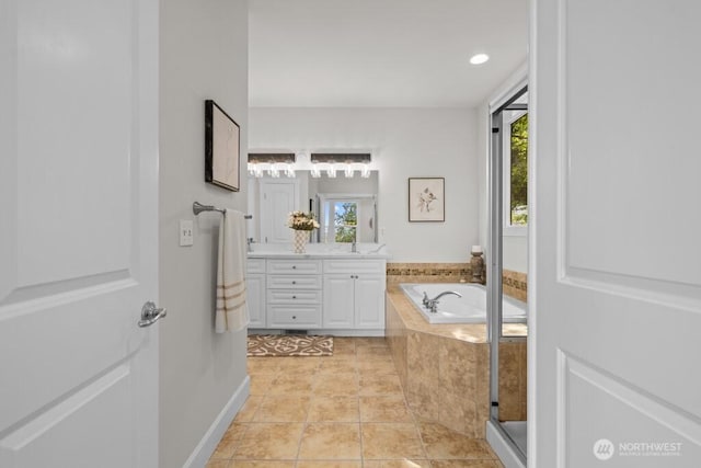 9304 S 223rd Pl, Kent, WA 98031 - bathroom with double vanity, healthy amount of natural light, a garden tub, and tile patterned floors