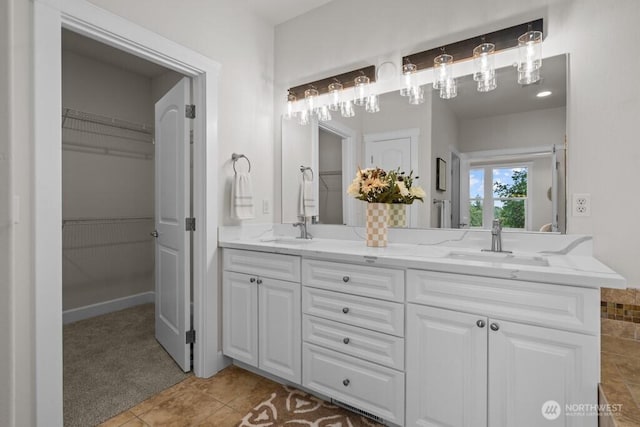 9304 S 223rd Pl, Kent, WA 98031 - full bath featuring double vanity, tile patterned floors, and a walk in closet