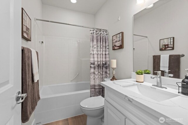 9304 S 223rd Pl, Kent, WA 98031 - full bath with vanity, toilet, shower / bath combo with shower curtain, and wood finished floors