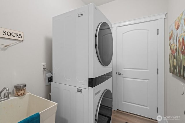 9304 S 223rd Pl, Kent, WA 98031 - laundry room with estacked washer and dryer and wood finished floors