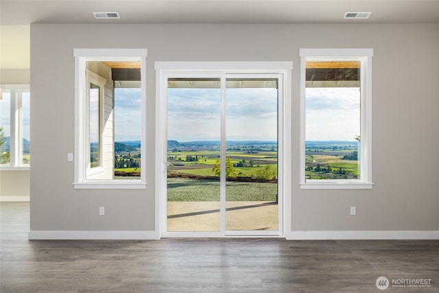 7514 Avalon Heights Way, Sedro Woolley, WA 98284 - unfurnished room featuring wood finished floors, baseboards, and plenty of natural light