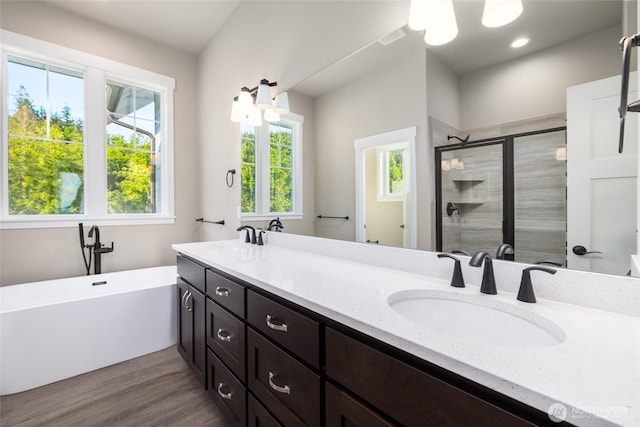 7514 Avalon Heights Way, Sedro Woolley, WA 98284 - full bath featuring a shower stall, a freestanding bath, double vanity, wood finished floors, and recessed lighting