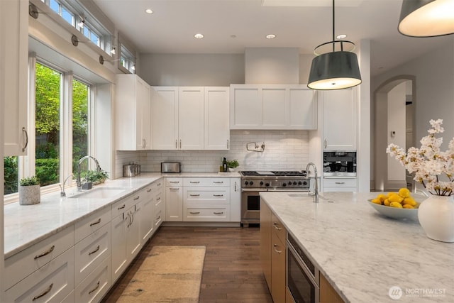 9420 NE 31st St, Clyde Hill, WA 98004 - kitchen with stainless steel appliances, white cabinetry, tasteful backsplash, and recessed lighting